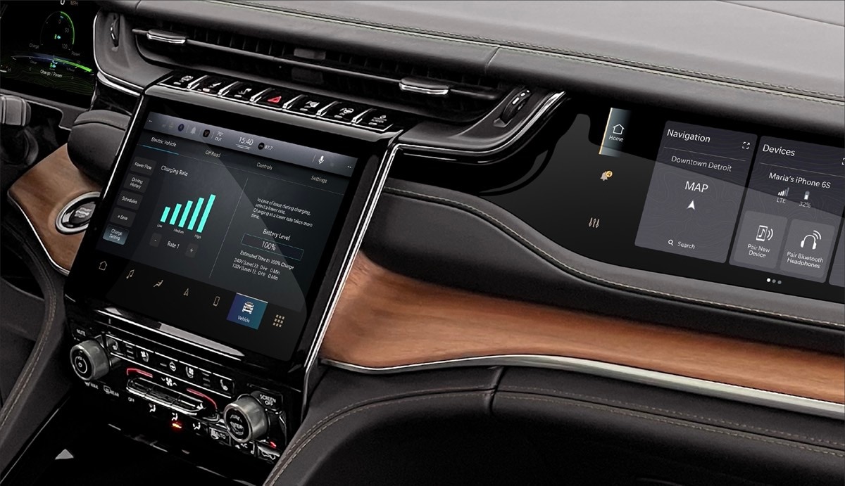 view of the central console and of the multiple touch screens available inside of the 2022 Jeep Grand Cherokee 4xe