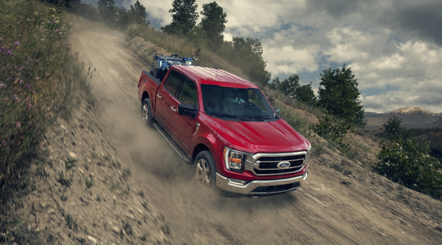 2021 ford f-150 red driving down the hill