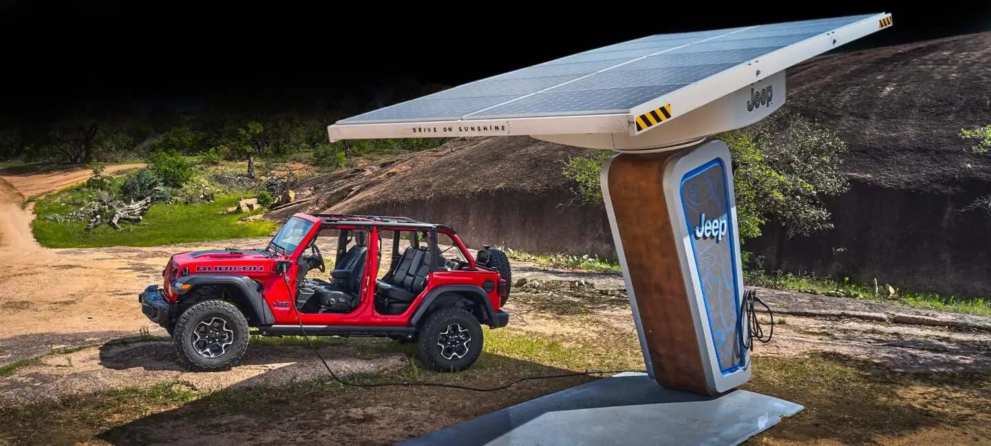 Electric Jeep plugged into solar panel