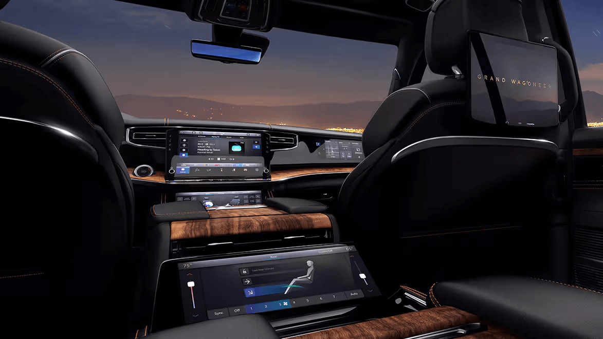 Learn about the technology features of the Jeep Wagoneer Interior shot of the Jeep Grand Wagoneer showing multiple infotainment screens available