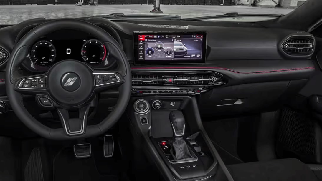 Learn about the 2025 Dodge Hornet An interior shot of the Dodge Hornet showing the steering wheel, dashboard, and infotainment screen