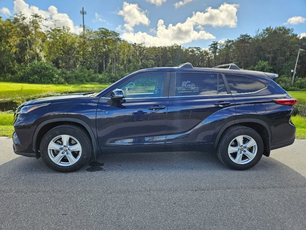 Used 2023 Toyota Highlander LE with VIN 5TDKDRAH2PS017444 for sale in Orlando, FL