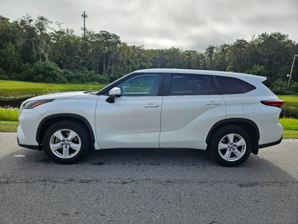 Used 2023 Toyota Highlander LE with VIN 5TDKDRBH3PS002420 for sale in Orlando, FL