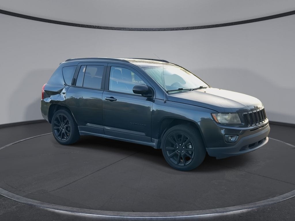 Used 2014 Jeep Compass Sport with VIN 1C4NJCBA7ED849472 for sale in Orlando, FL