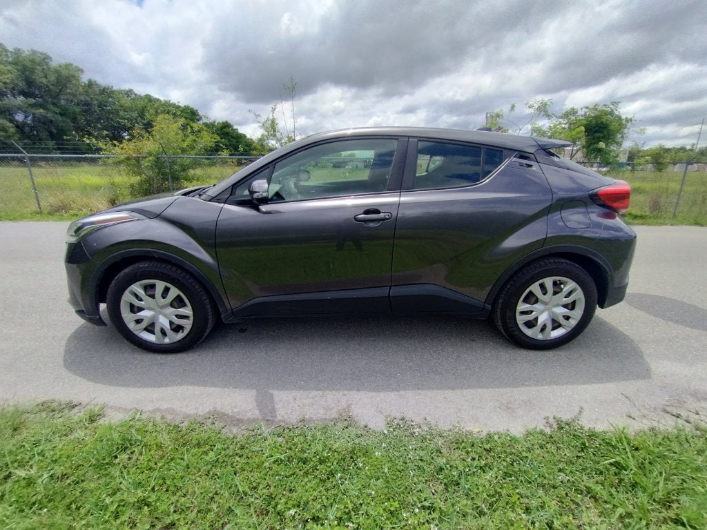 Used 2021 Toyota C-HR LE with VIN JTNKHMBX7M1107321 for sale in Orlando, FL