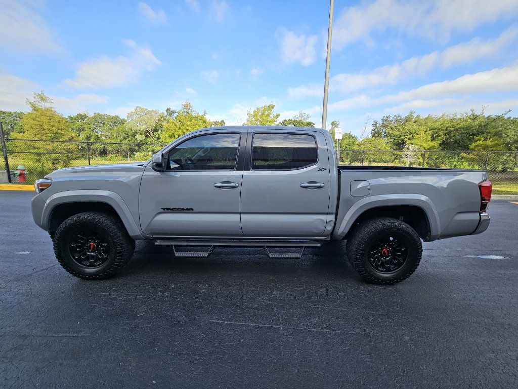 Used 2021 Toyota Tacoma SR5 with VIN 3TMAZ5CN4MM148542 for sale in Orlando, FL