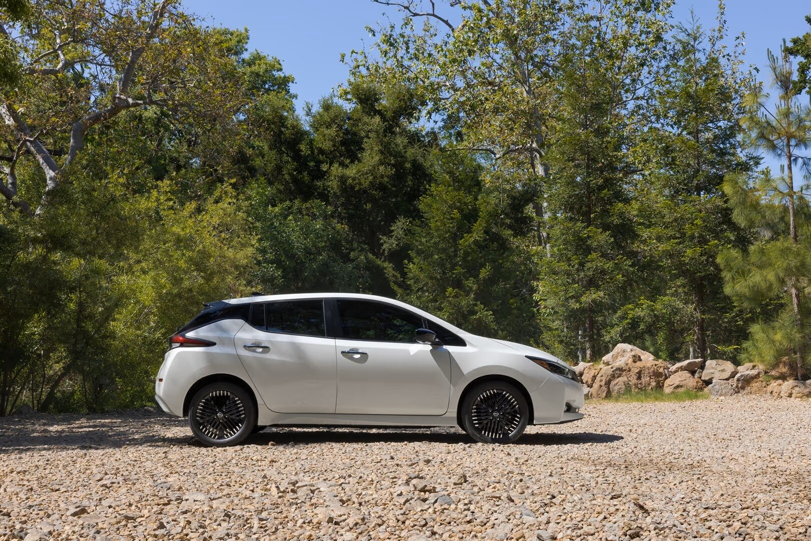 Nissan parked on a river bank