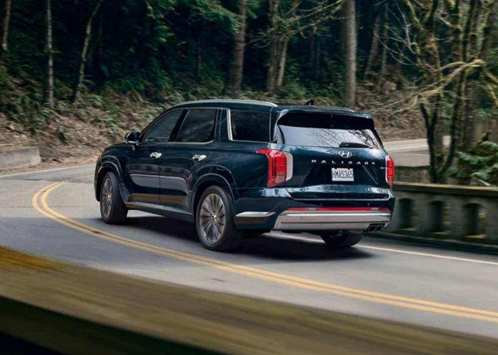 2024 Hyundai Palisade driving around a curve