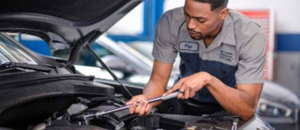 mechanic working the engine of a Hyundai