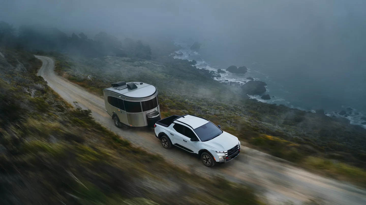 2025 Hyundai Santa Cruz towing a camper