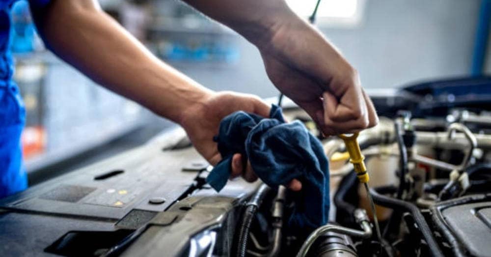 coolant being checked in a radiator