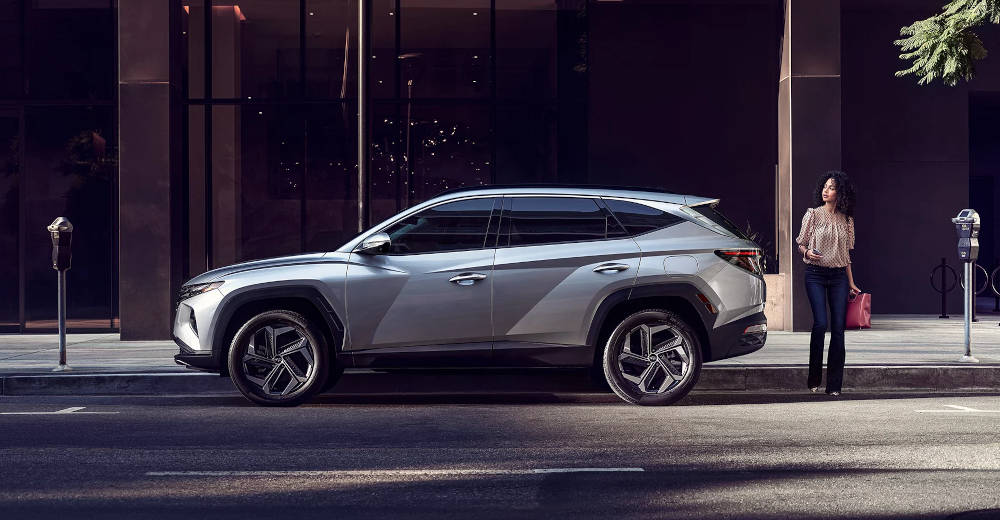 2024 Hyundai Tucson parked with women standing behind it