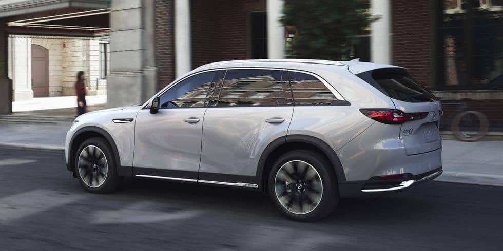 2024 MAZDA CX-90 driving through the city