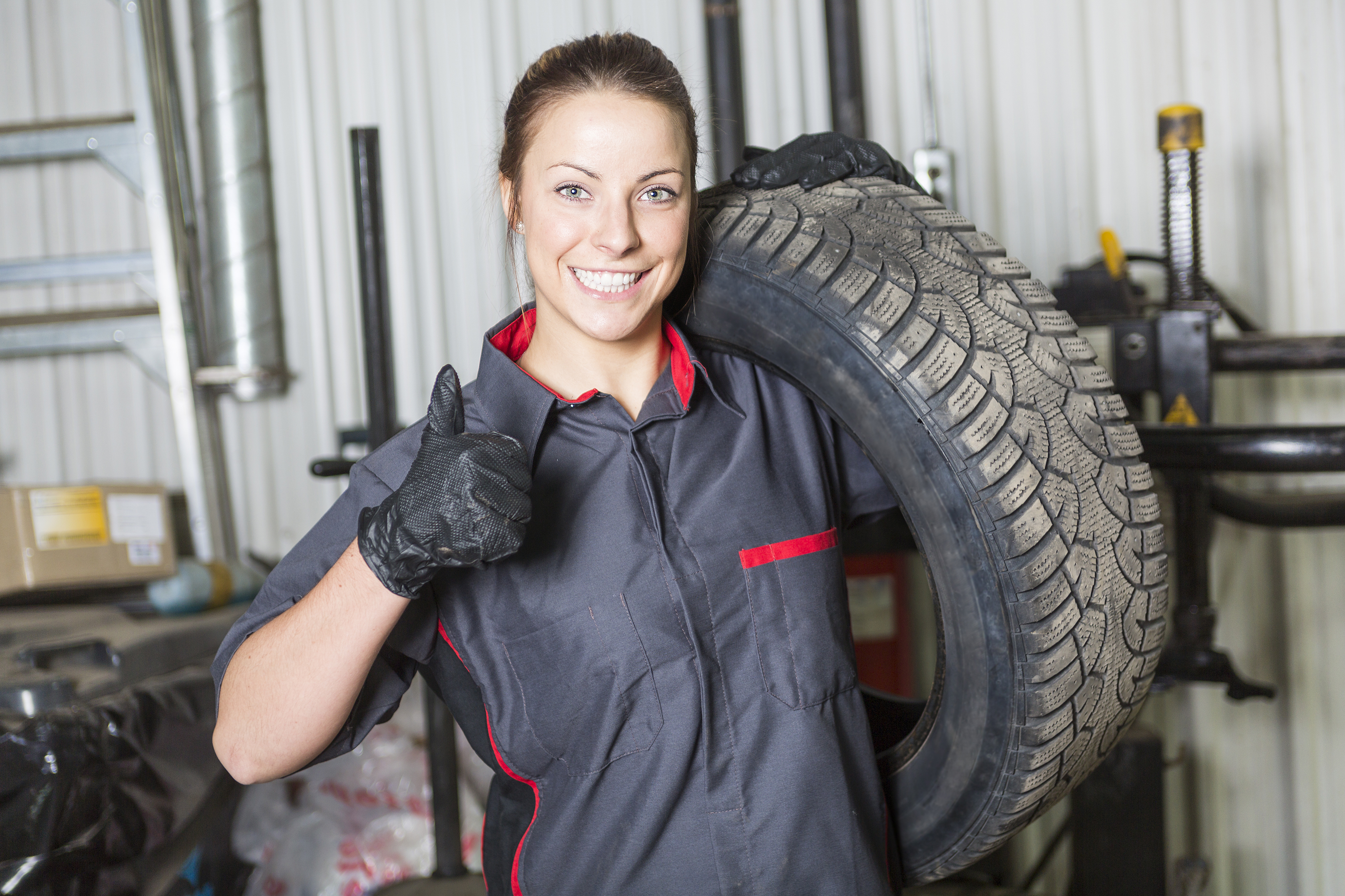 Mazda technician holding tires