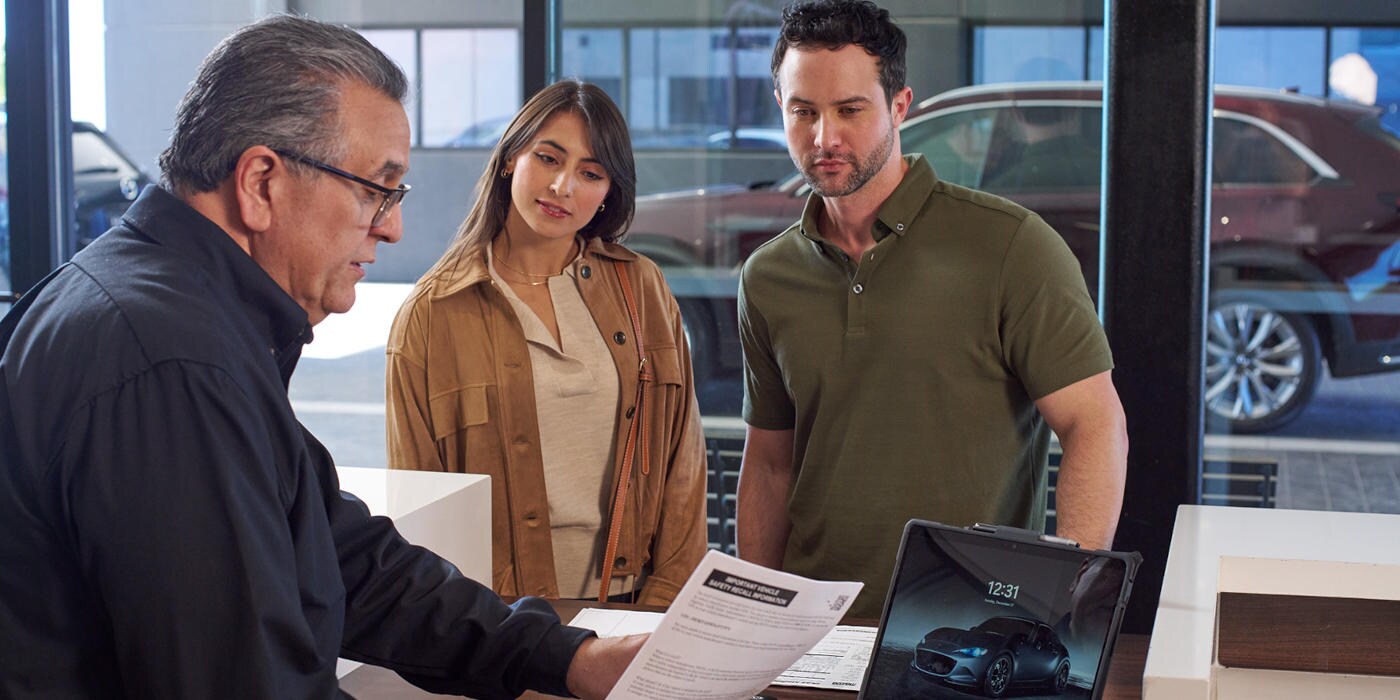 Mazda Mechanic Meeting talking with customers in the lobby