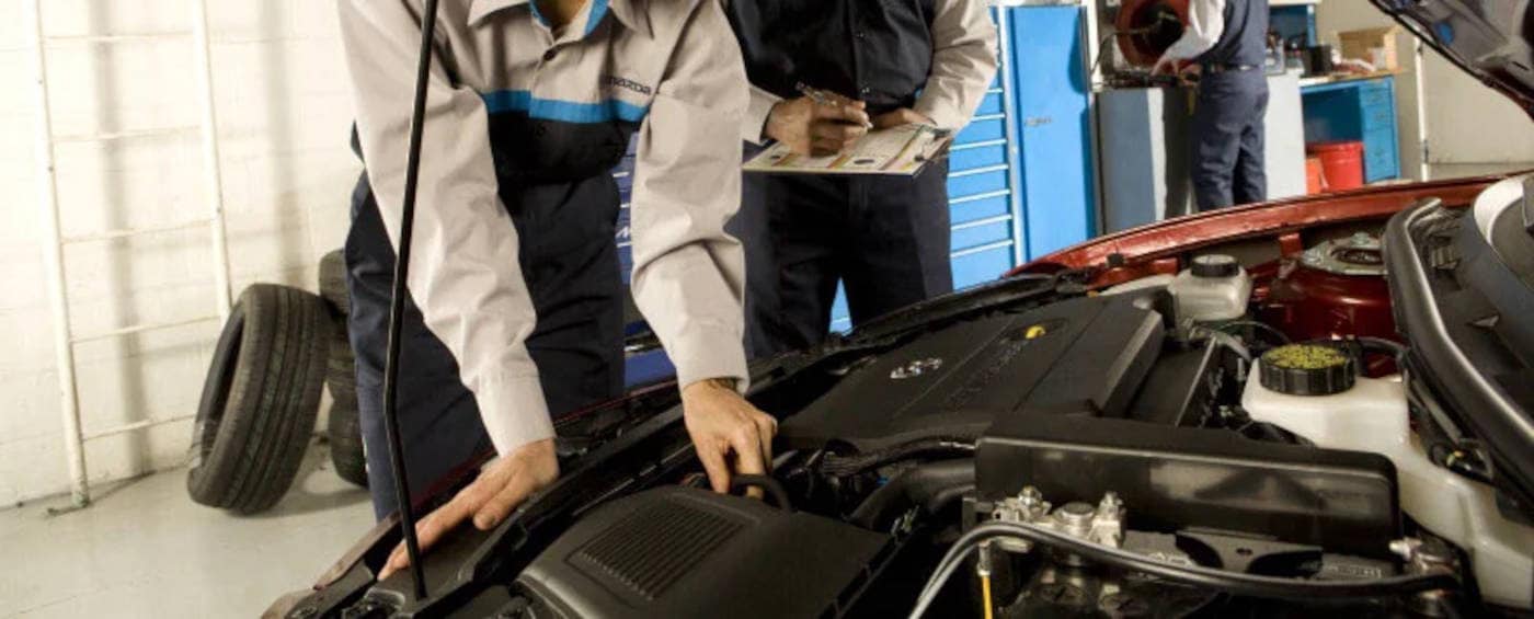 Mazda Mechanics working on an engine