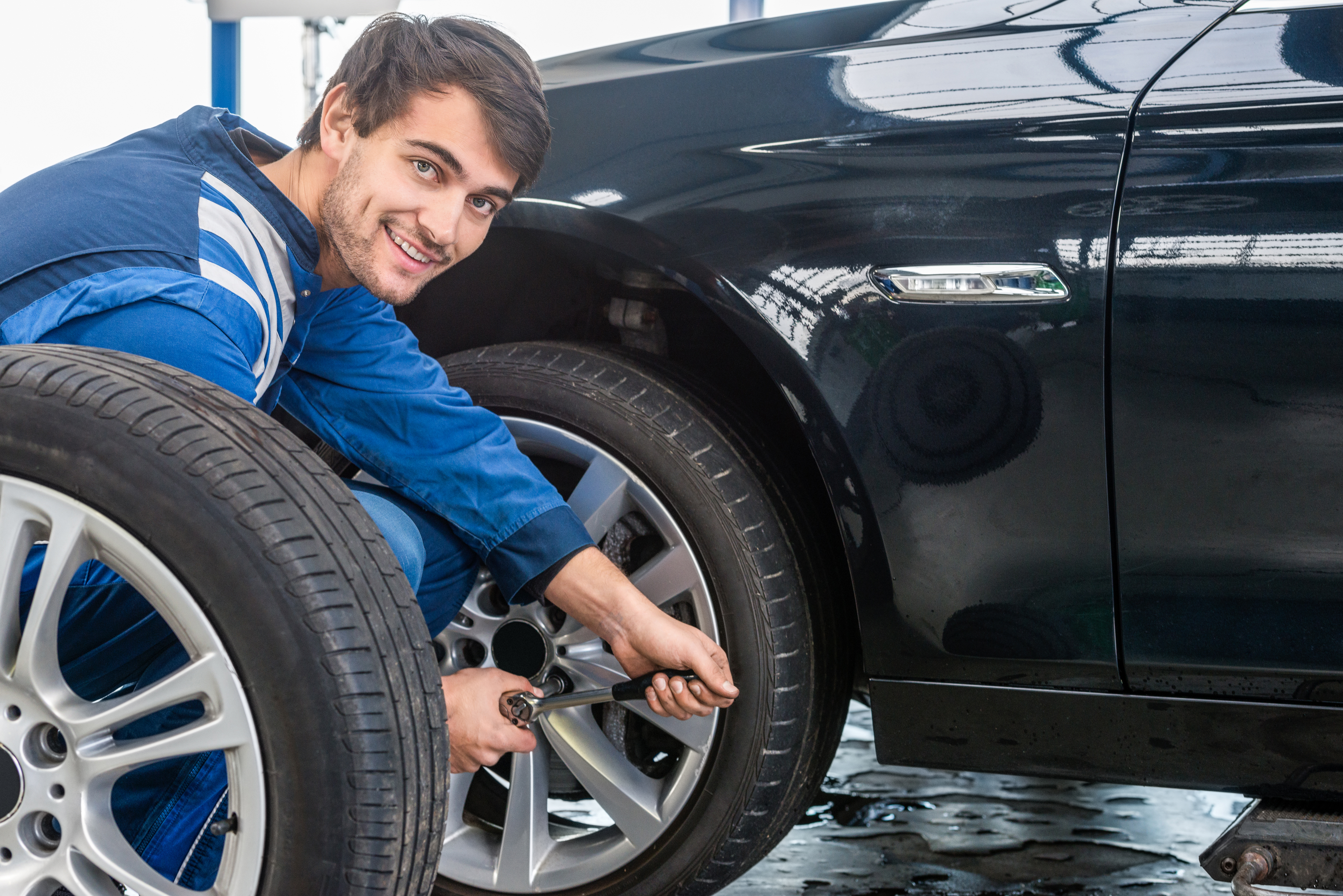 Mazda technician changing tires