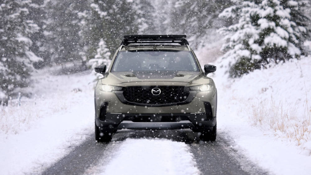 Mazda CX-50 driving through the snow