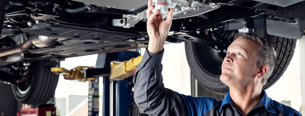 Mazda Mechanic changing an oil filter