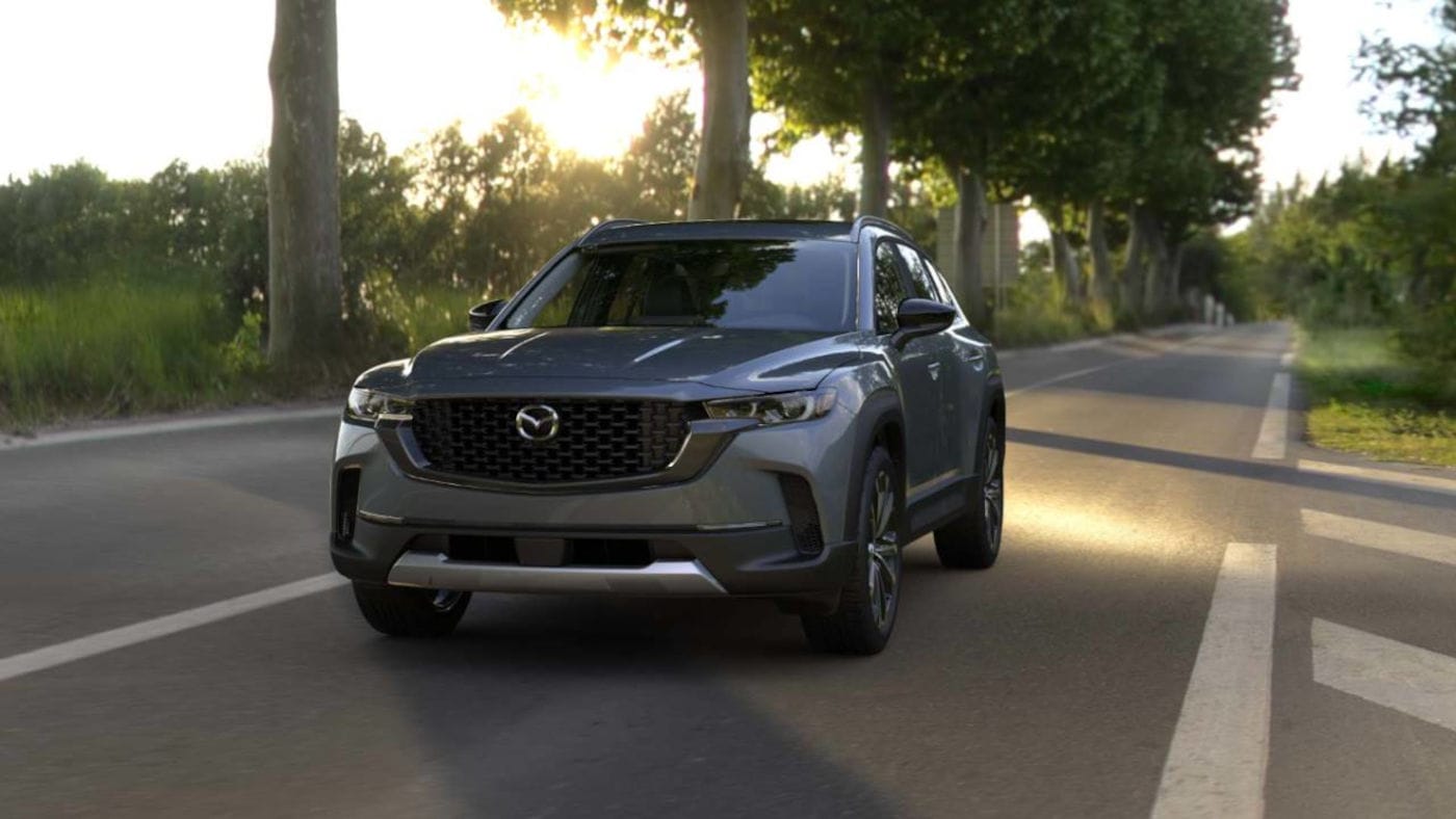 2025 Mazda CX-50 driving down the road