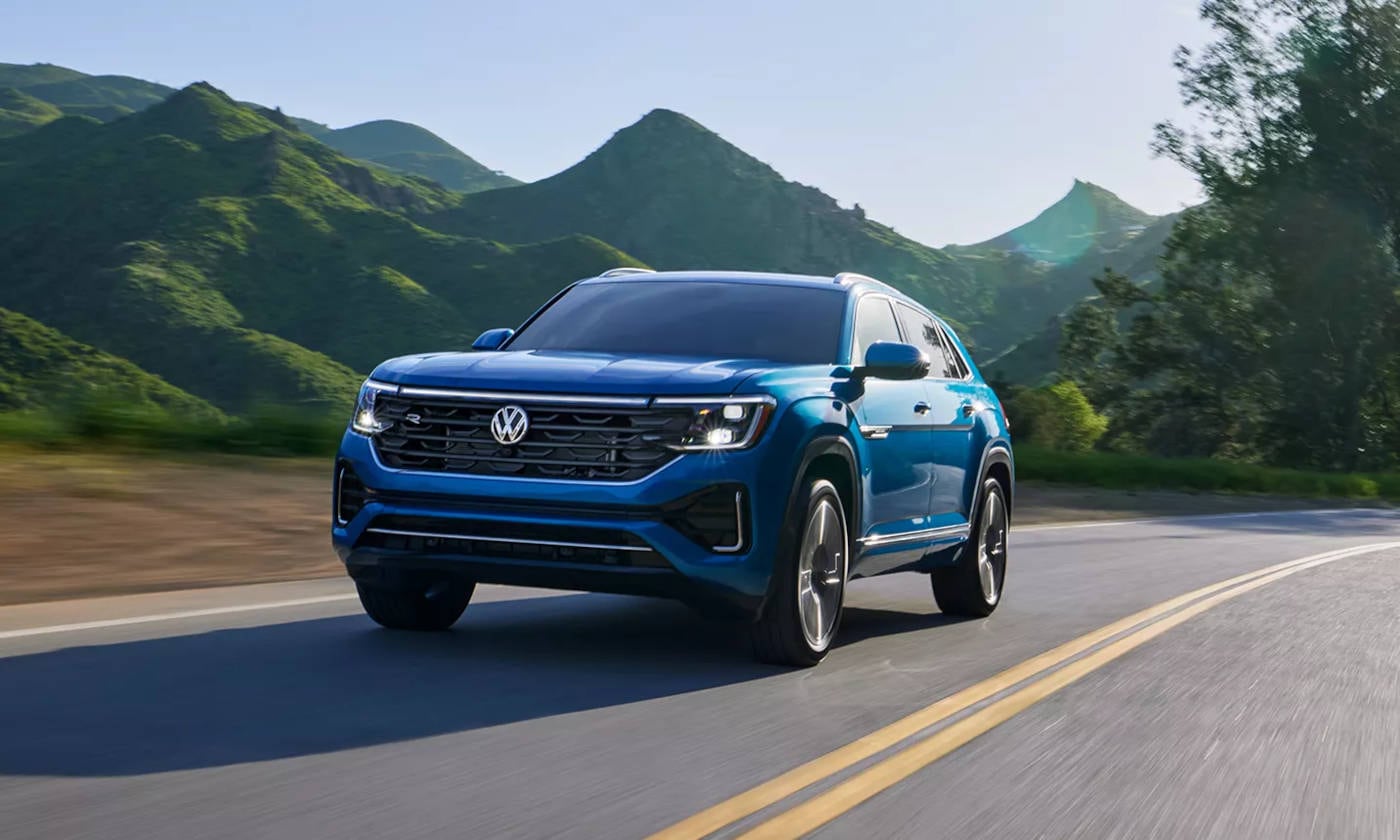2024 Volkswagen Atlas Cross Sport driving through the mountains