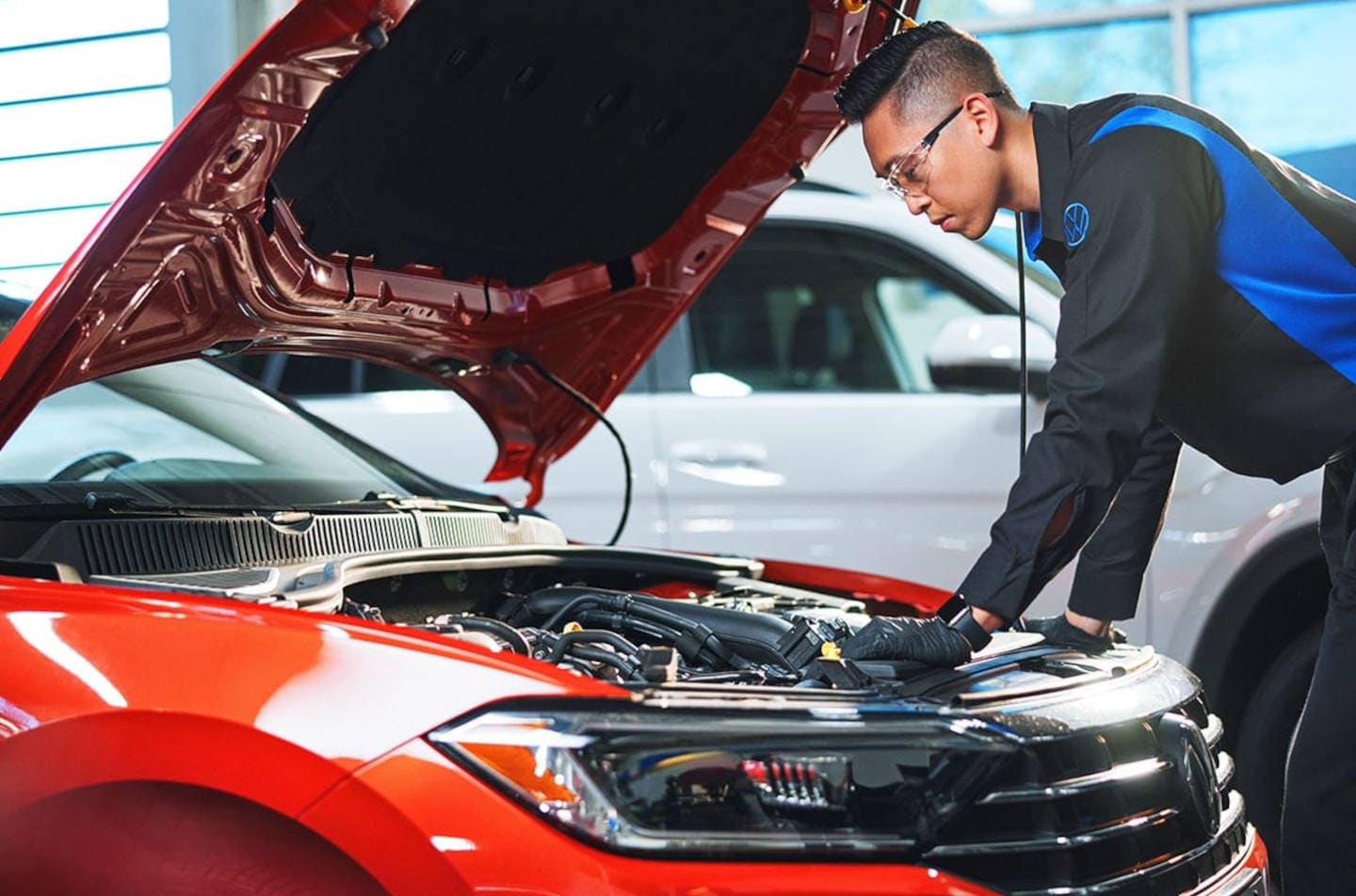 Picture of mechanic servicing a Volkswagen