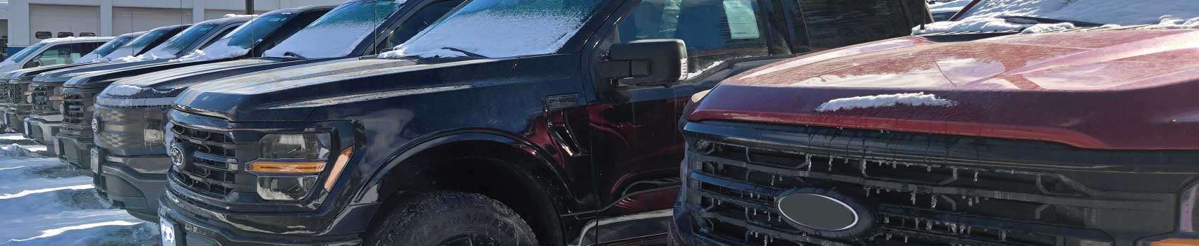 Trucks at a rural Vermont dealership illustrating 2025 Vermont auto market trends