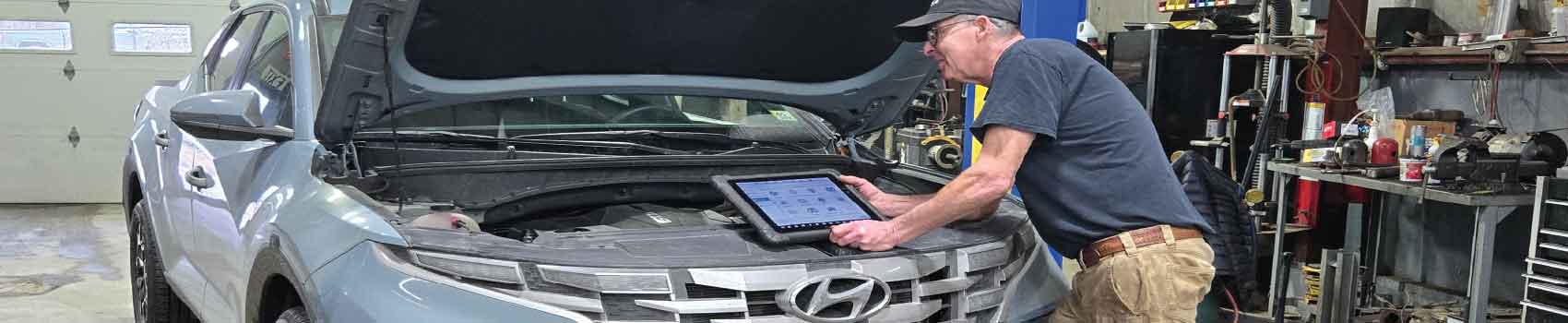 Technician performing Hyundai service and diagnostics at Central Vermont Auto Mart in Barre Montpelier Vermont