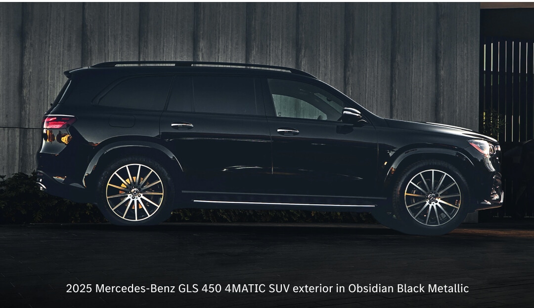 Side view of 26 Mercedes-Benz GLS 450 in Obsidian Black parked in a modern driveway.