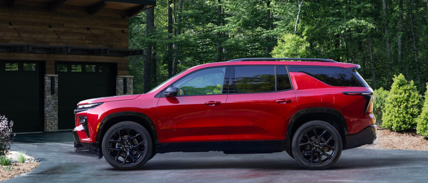 2026 Chevy Traverse parked on forested driveway