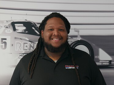 Staff member AJ Simmons from 3c79ab7fc330