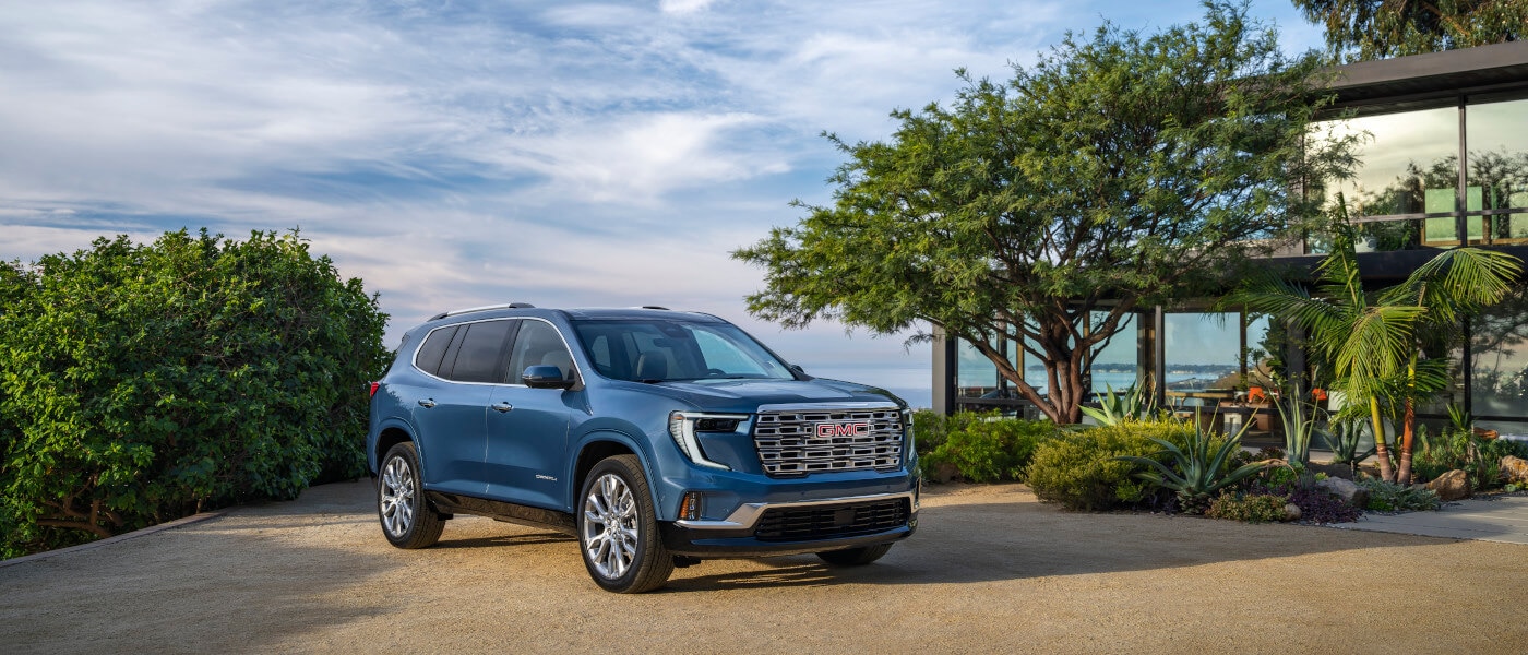 2026 Acadia parked by seaside house