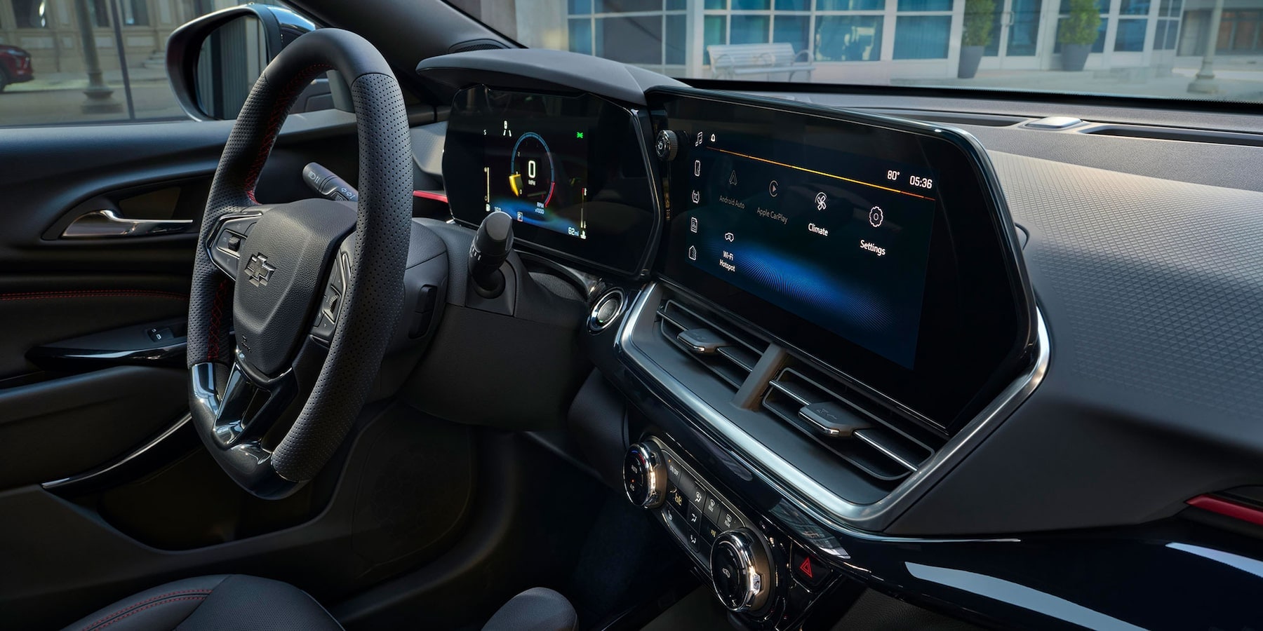 Inside passenger view of Chevy Trax infotainment and gauge cluster