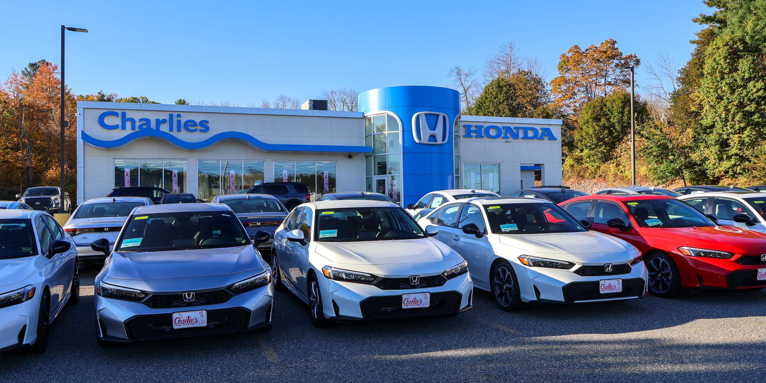  Person cheerfully signing documents.