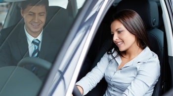 woman looking at a car