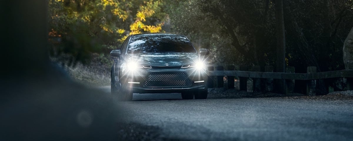 Toyota Corolla with headlights on