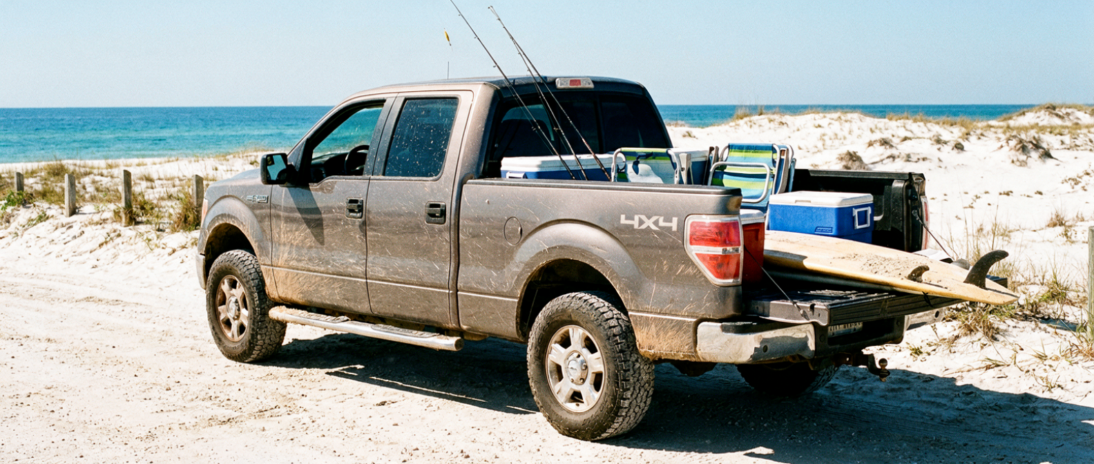 Used 4x4 pickup truck on sandy Gulf Coast beach access road near Rick Seltzer Park, Panama City Beach FL