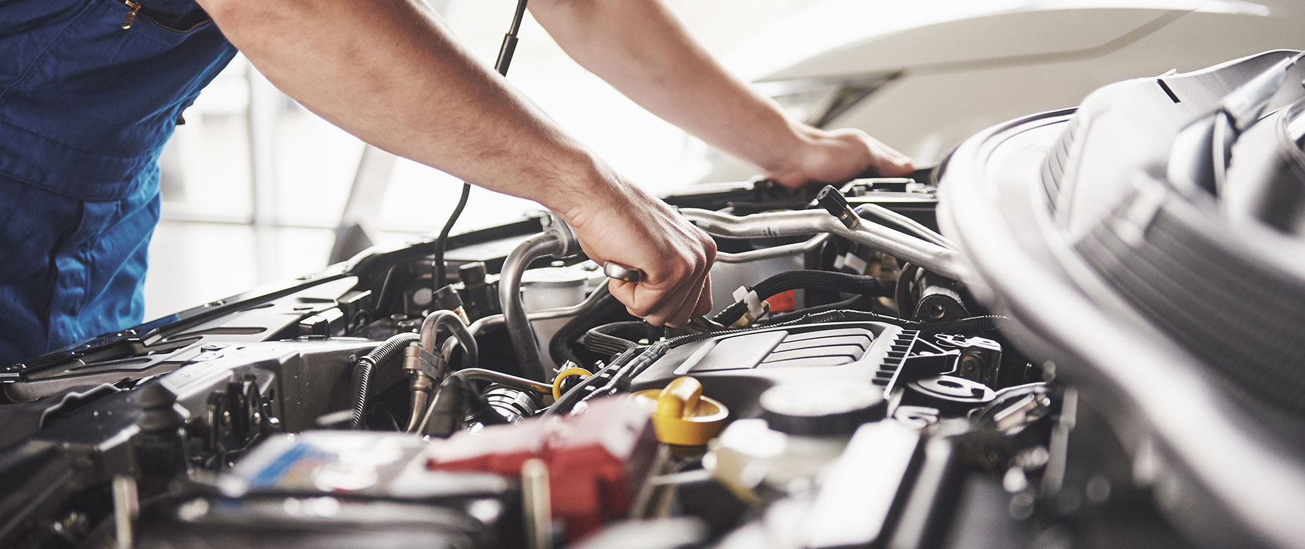 Service Your Cars, Trucks & SUVs in Canfield, OH Technician running maintenance on an engine