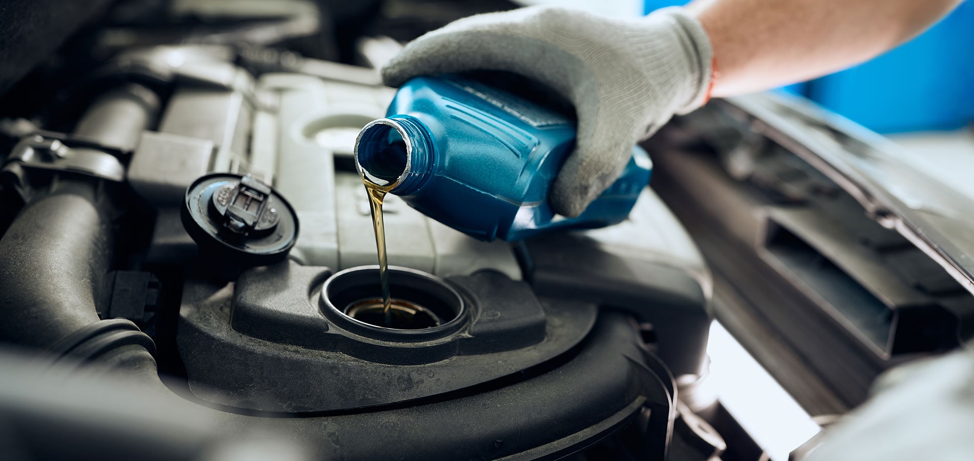 Auto Repair Shop in Canfield, OH Technician performing an oil change