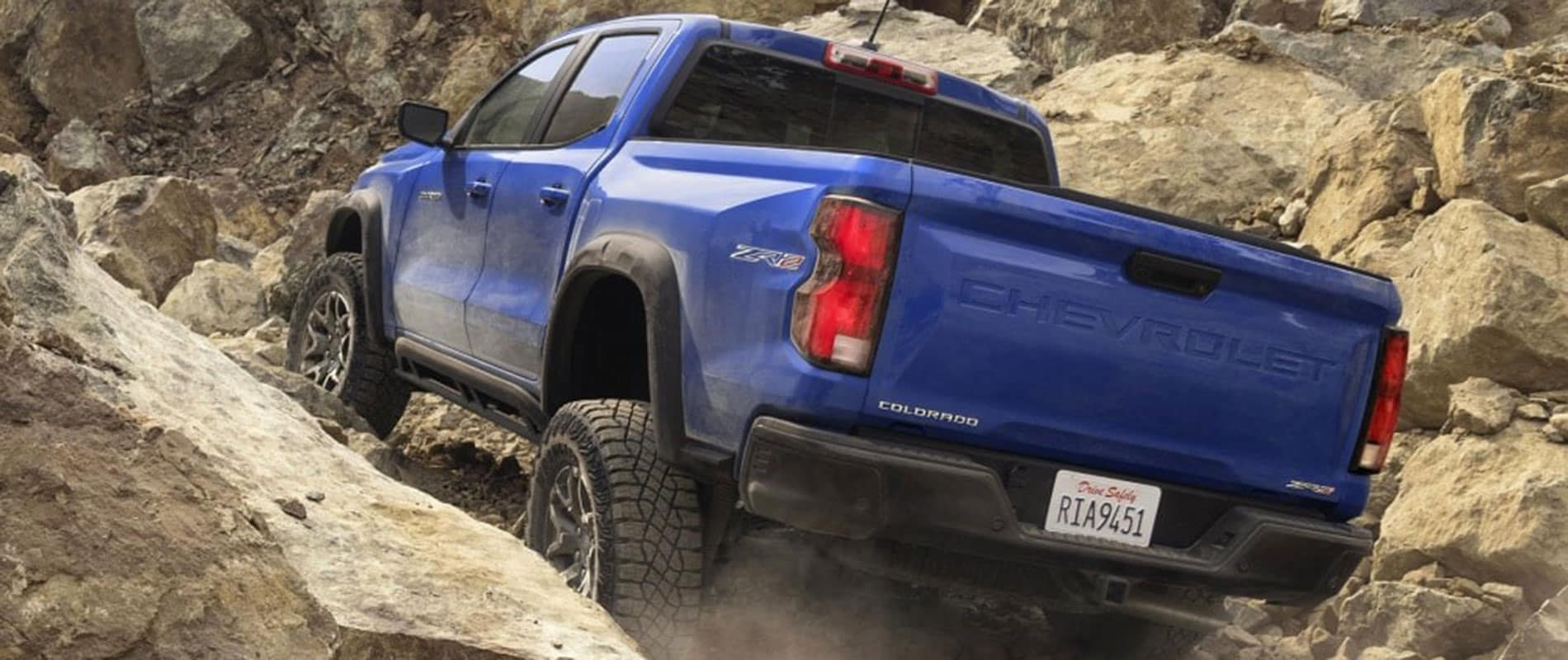 Used Chevrolet Models for Sale Near Youngstown, OH Blue Chevy Colorado driving up a rocky hill