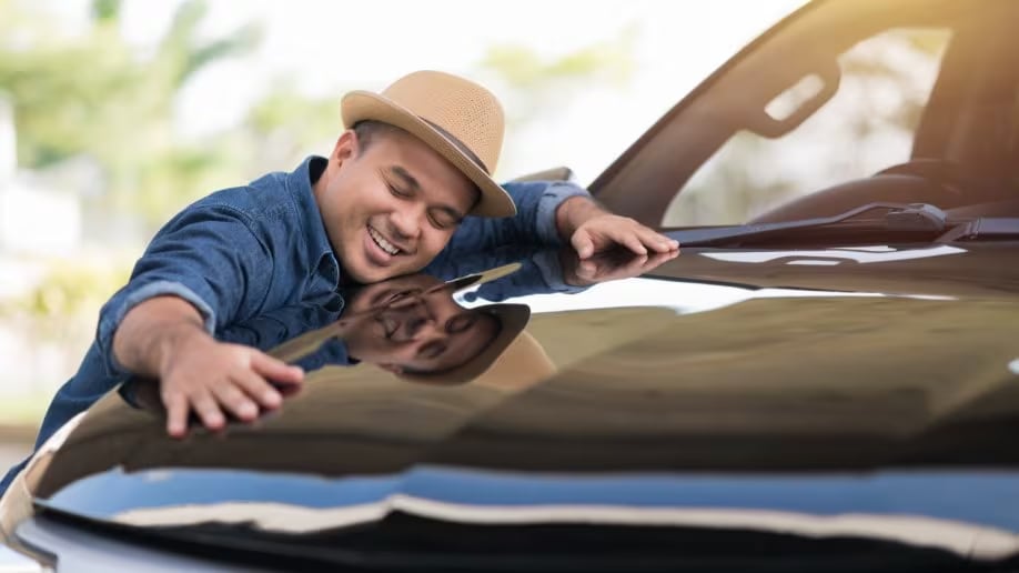 Guy celebrating buying a used car Guy celebrating buying a used car