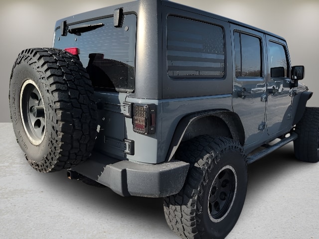 Used 2015 Jeep Wrangler Unlimited Sport with VIN 1C4BJWDG5FL597511 for sale in Carthage, MO