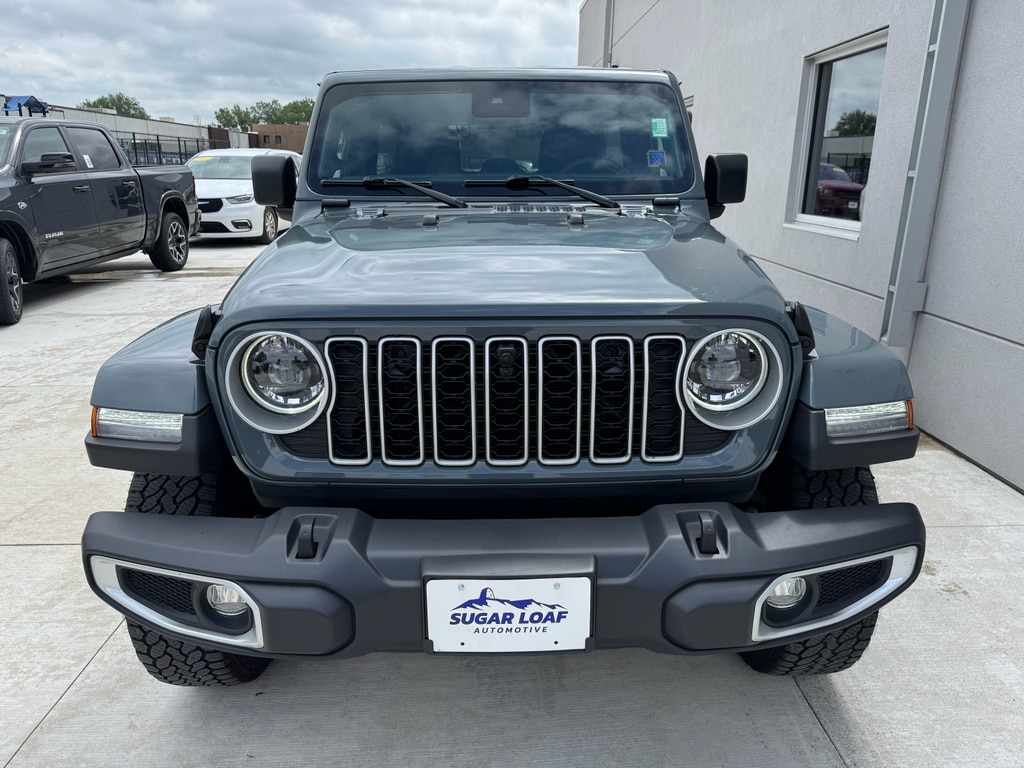 Used 2024 Jeep Wrangler 4-Door Sahara with VIN 1C4PJXEG5RW285296 for sale in Winona, Minnesota