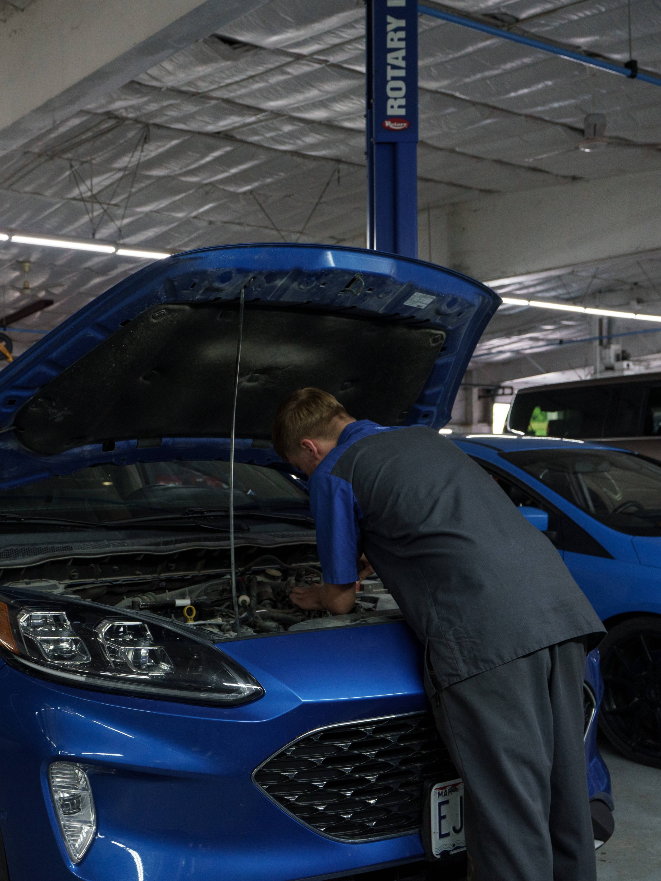 Checking engine oil with a vehicle dipstick