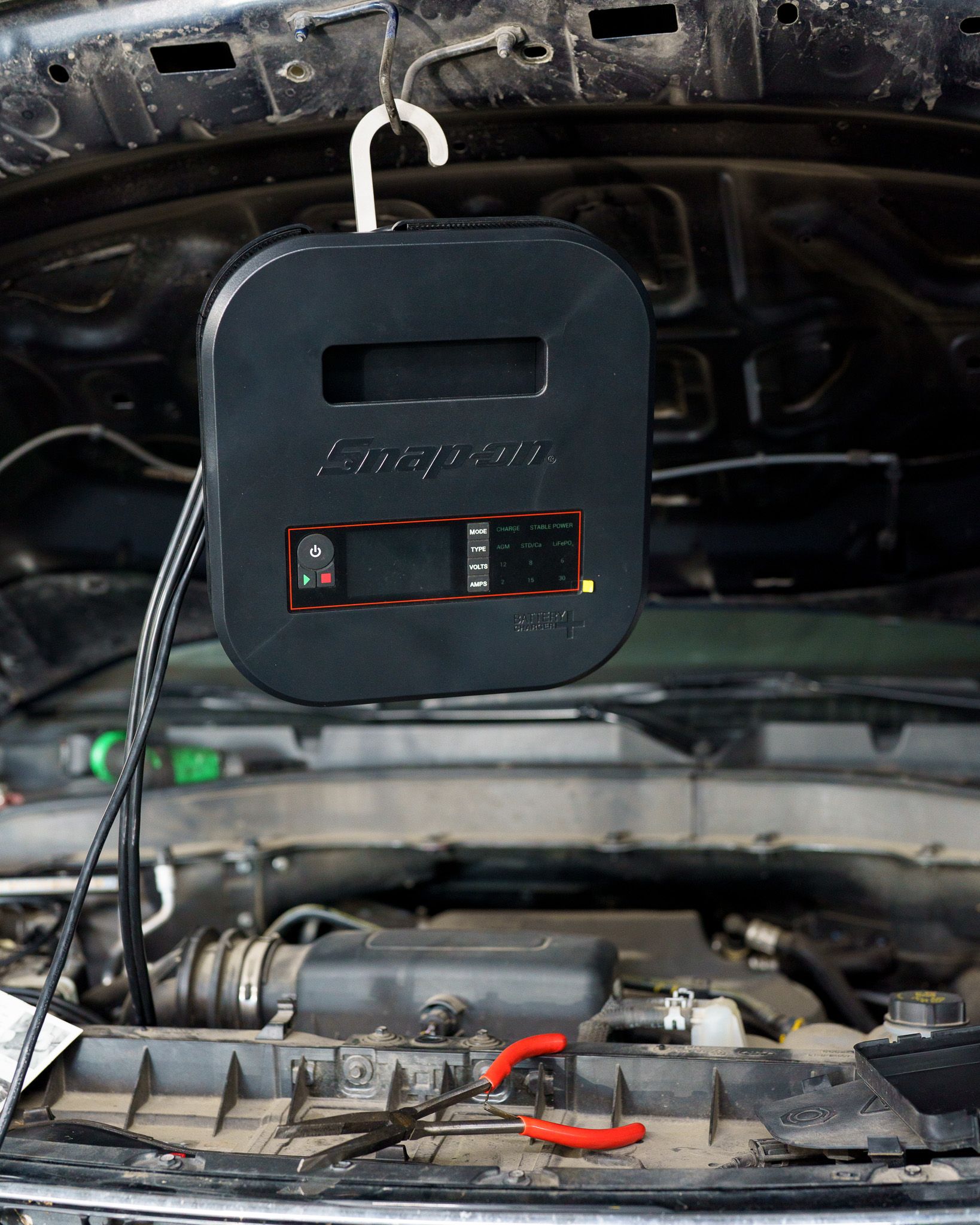 Vehicle filter inspected as part of routine maintenance