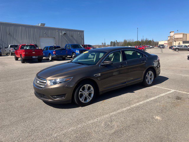 Used 2015 Ford Taurus SEL with VIN 1FAHP2H8XFG193980 for sale in Manistique, MI