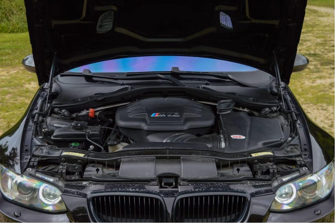 BMW with it's hood popped showing the inner engine as it is about to be serviced in York, PA