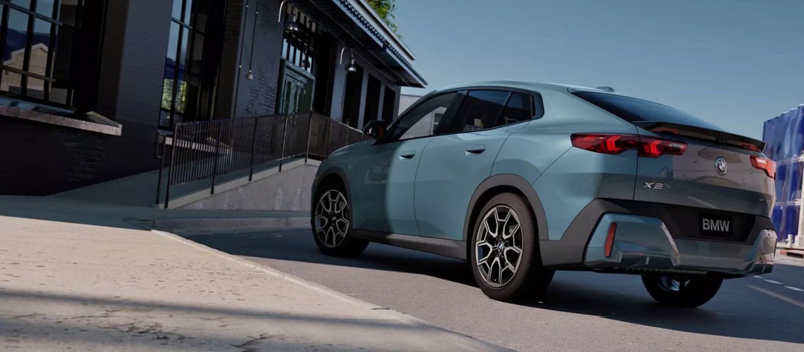 2026 BMW X2 parked beside a restaurant entrance