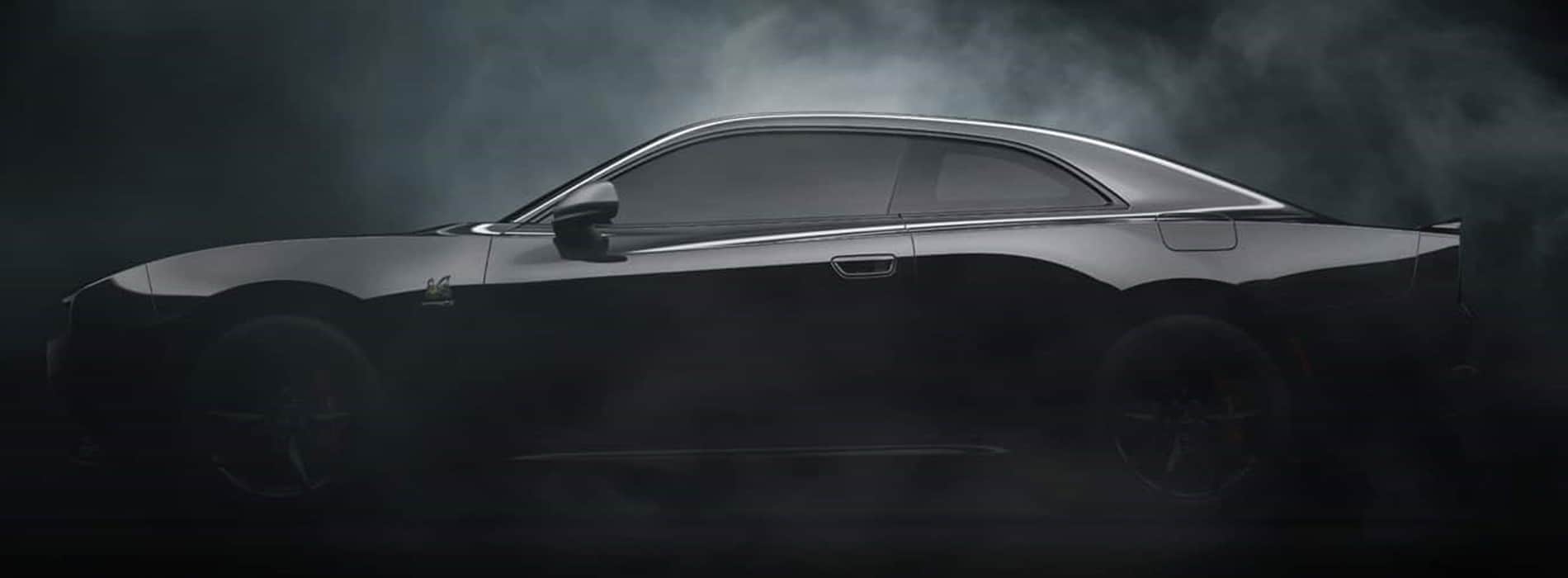 2025 Dodge Charger parked in a dark and misty room