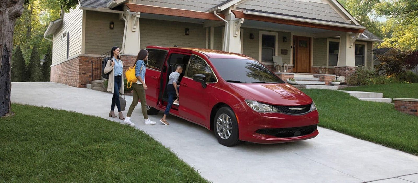 Family getting into their 2026 Chrysler Voyager